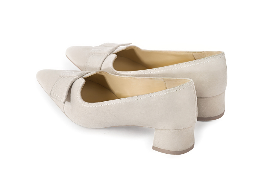 Off white women's dress pumps, with a knot on the front. Tapered toe. Low flare heels. Rear view - Florence KOOIJMAN